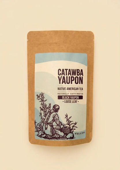 Catawba Yaupon Black Yaupon loose leaf tea in a brown kraft stand-up pouch with a light blue label.
