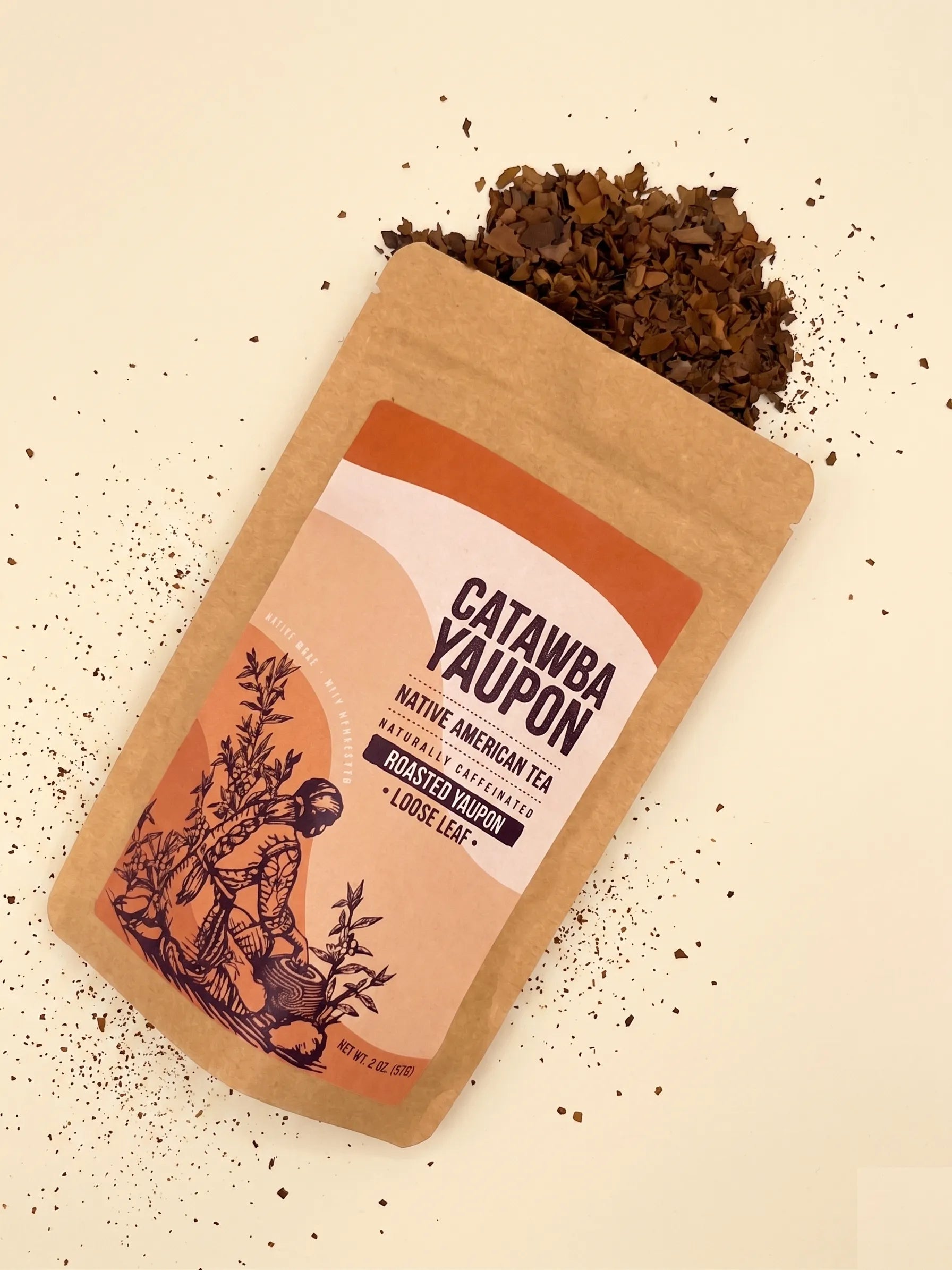 A brown craft paper pouch of Catawba Yaupon roasted loose leaf tea featuring an orange label with a harvest illustration.