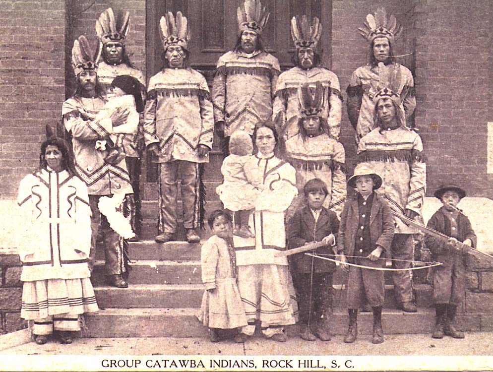A black and white historical photograph of a group of Catawba Indians in traditional attire, posing on steps in Rock Hill, South Carolina, representing the ancestral legacy of Catawba Yaupon Tea.
